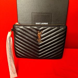 Yves Saint Laurent (YSL) wristlet clutch bag